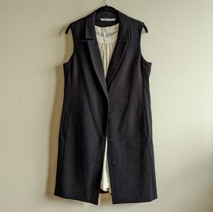 Sleeveless dress with suiting detail